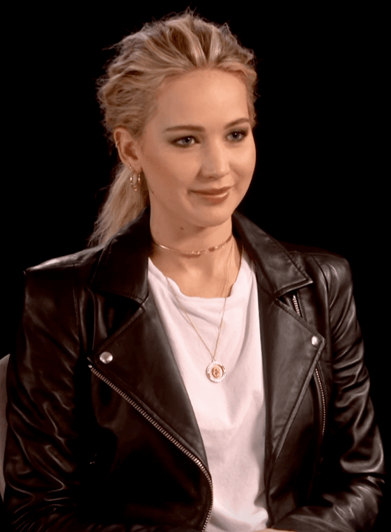 Jennifer Lawrence walking the red carpet with statuesque grace and authentic poise