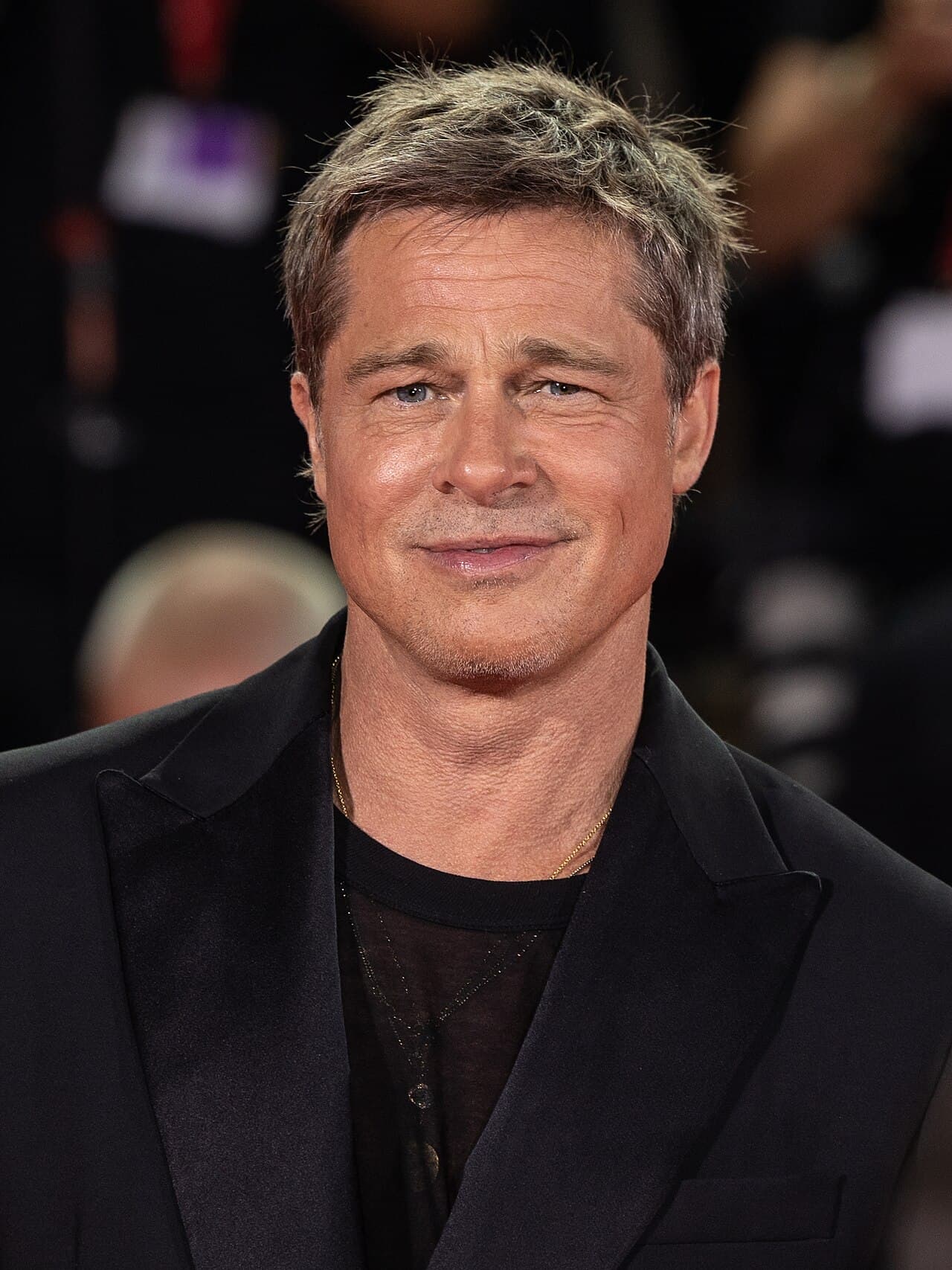 Brad Pitt attending international film festival premiere in sharp tailoring