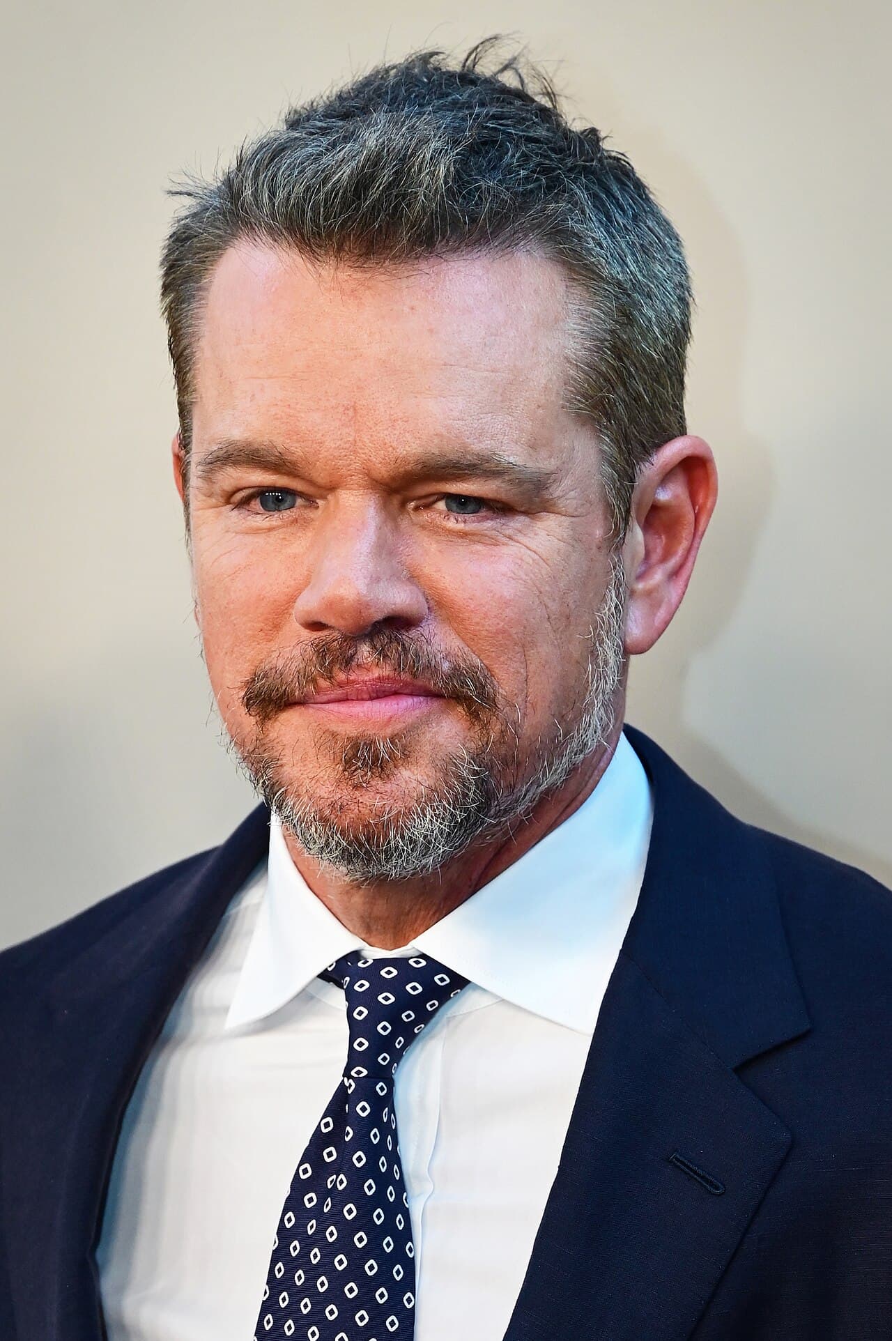 Matt Damon portrait in formal black suit at international film festival premiere